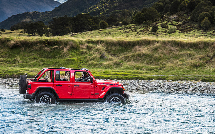 Jeep Wrangler effortlessly driving through wheel high water